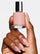 BARELY THERE 5-IN-1 RAPID GROWTH NAIL TREATMENTHand holding a bottle of pink nail polish with &