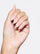 SIGNATURE PINK 5-IN-1 RAPID GROWTH NAIL TREATMENTHand with pink nail polish on a pink background