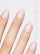 SOFT GIRL PINK 5-IN-1 RAPID GROWTH NAIL TREATMENTClose-up of a hand with pink nail polish on a light gray background