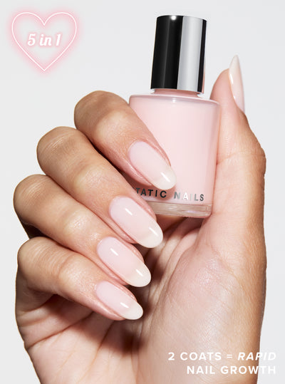 SOFT GIRL PINK 5-IN-1 RAPID GROWTH NAIL TREATMENTHand holding a bottle of &