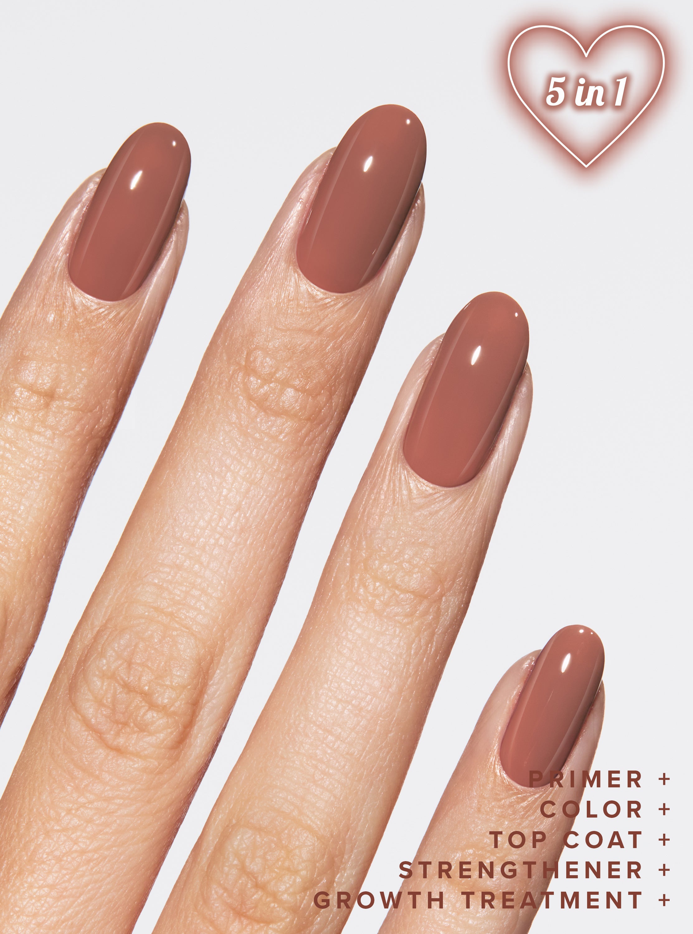 Nail polish with a heart-shaped design and text on a light background