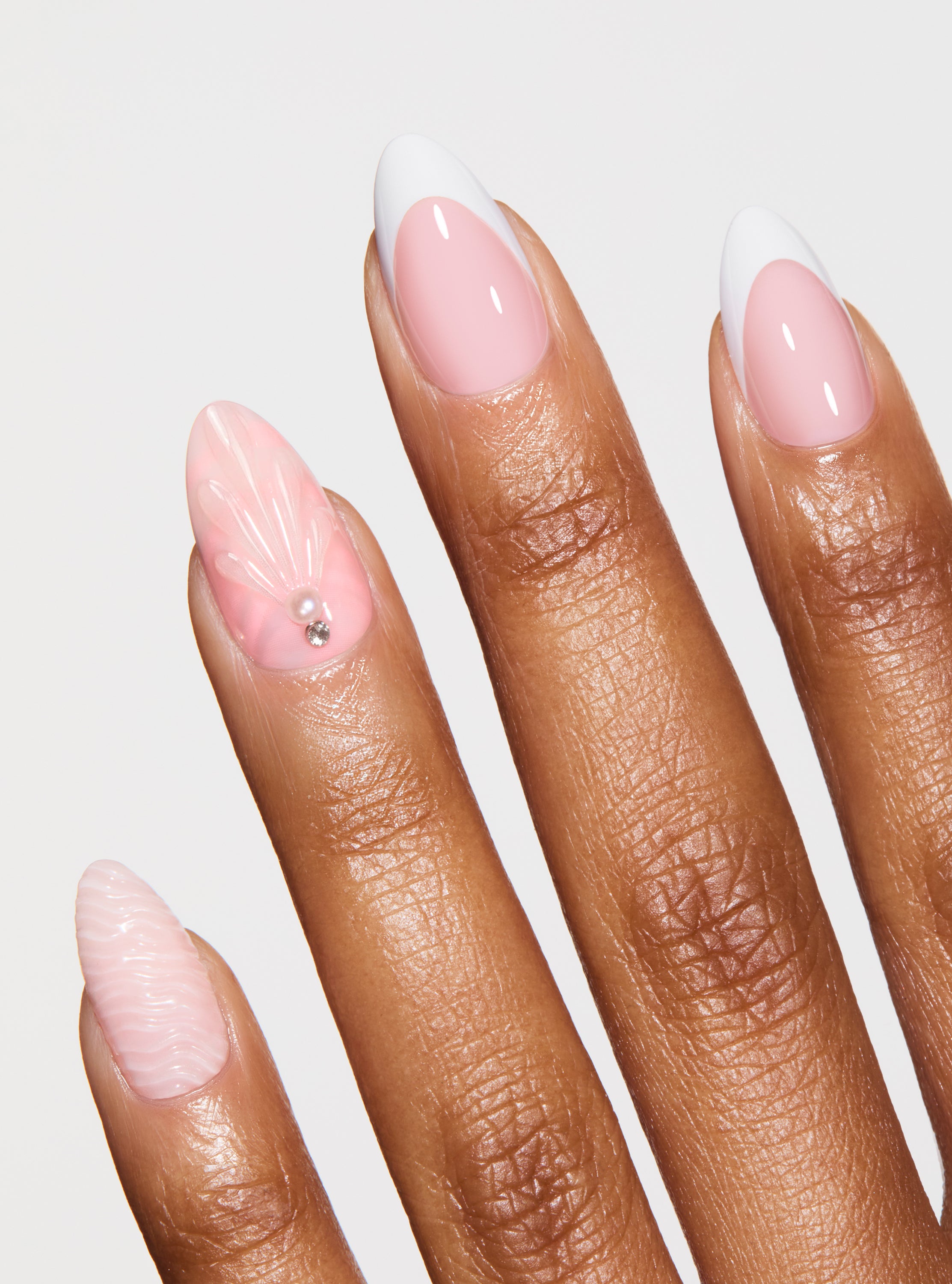 The best, most durable press-on nails. White french manicure design with 3D shell print nails