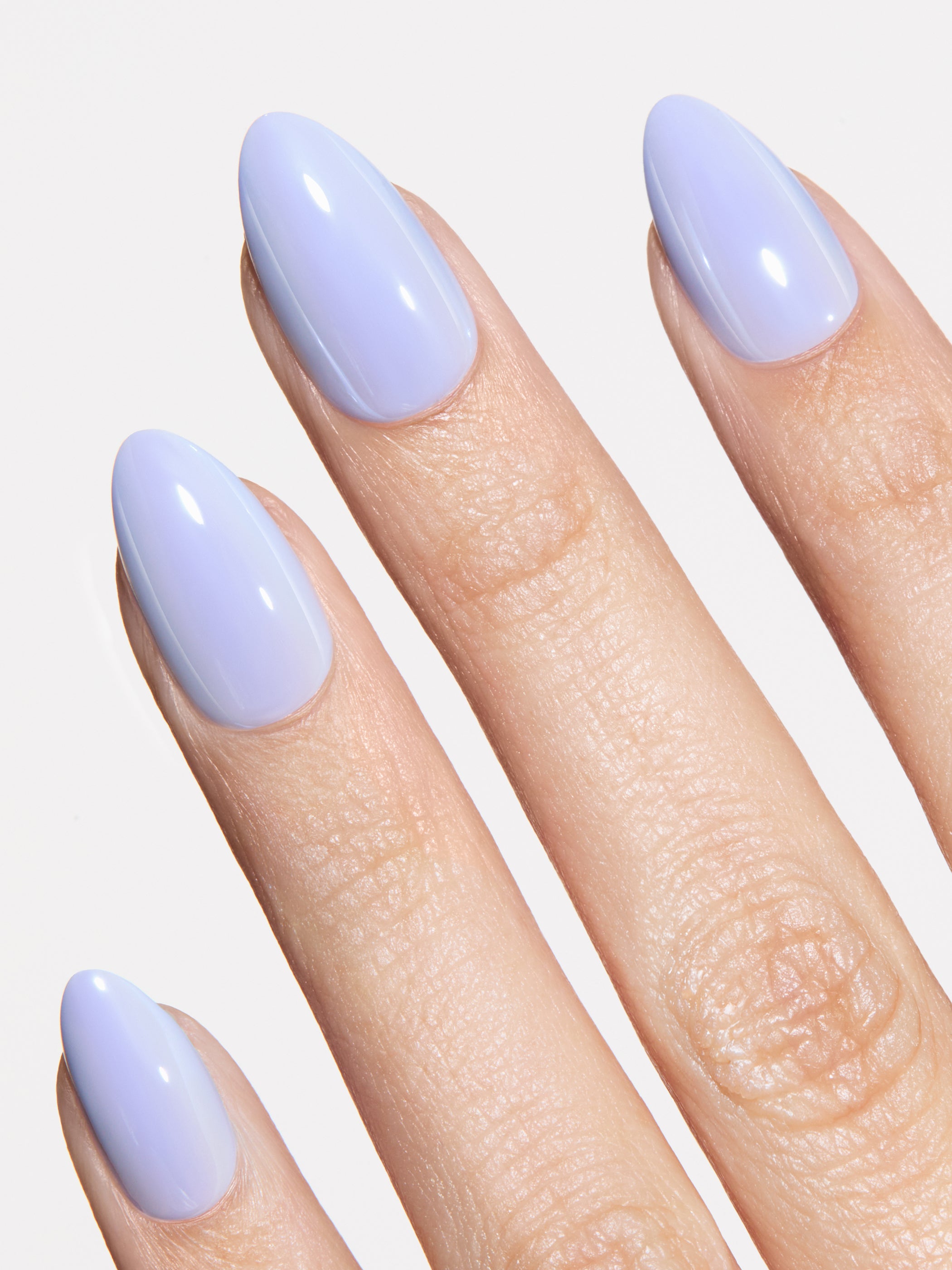 blue glazed press-on nails on hand