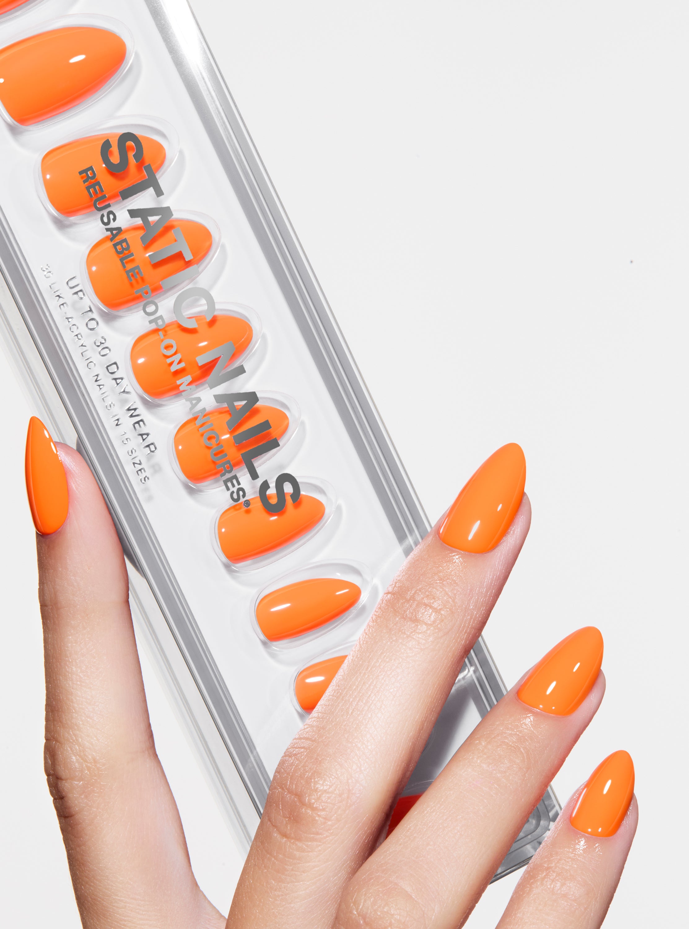 The best, most durable press-on nails. Neon orange almond nails