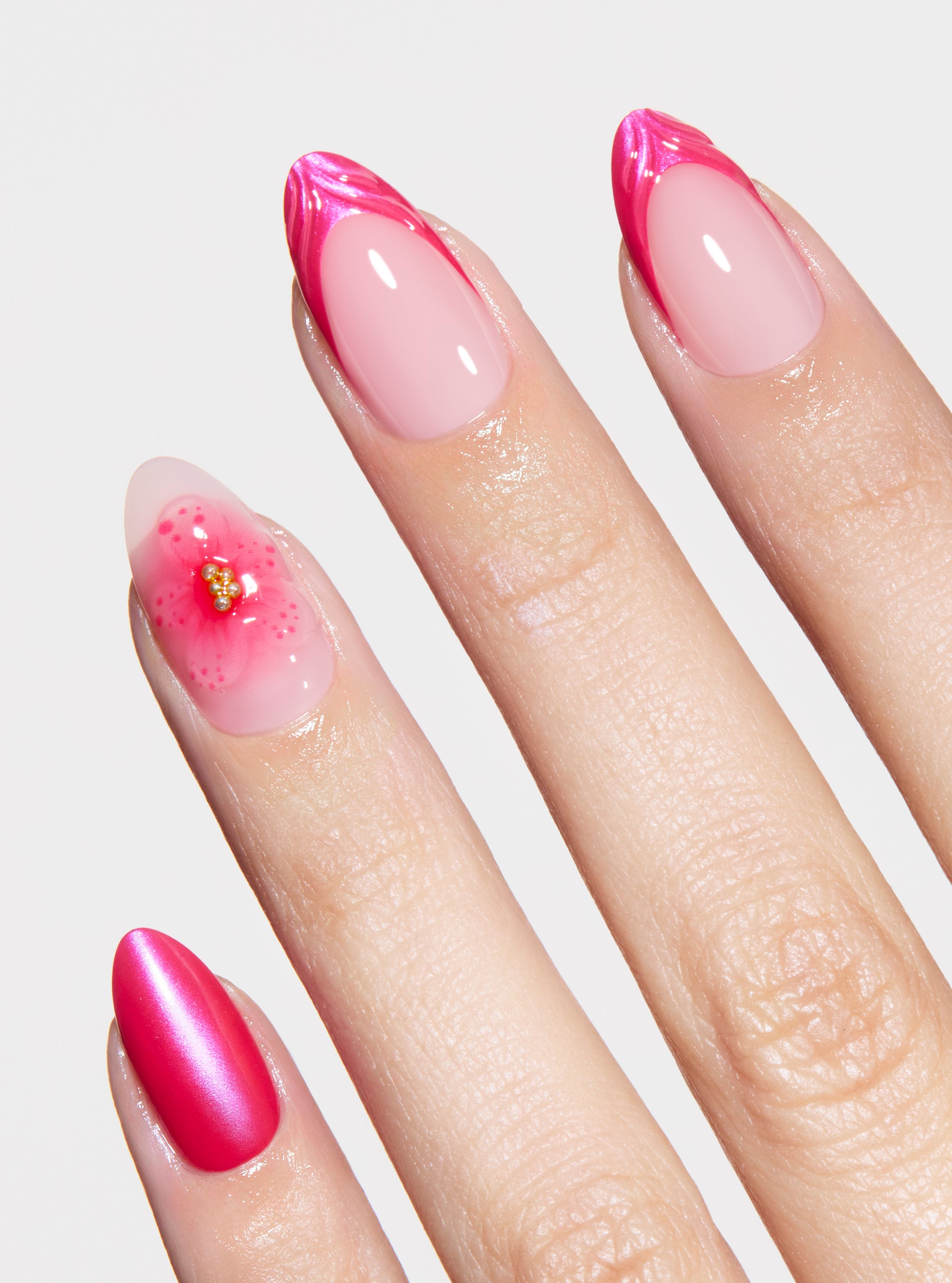The best, most durable press-on nails. french manicure design with hot pink 3D shell french tip and 3D floral accent nail