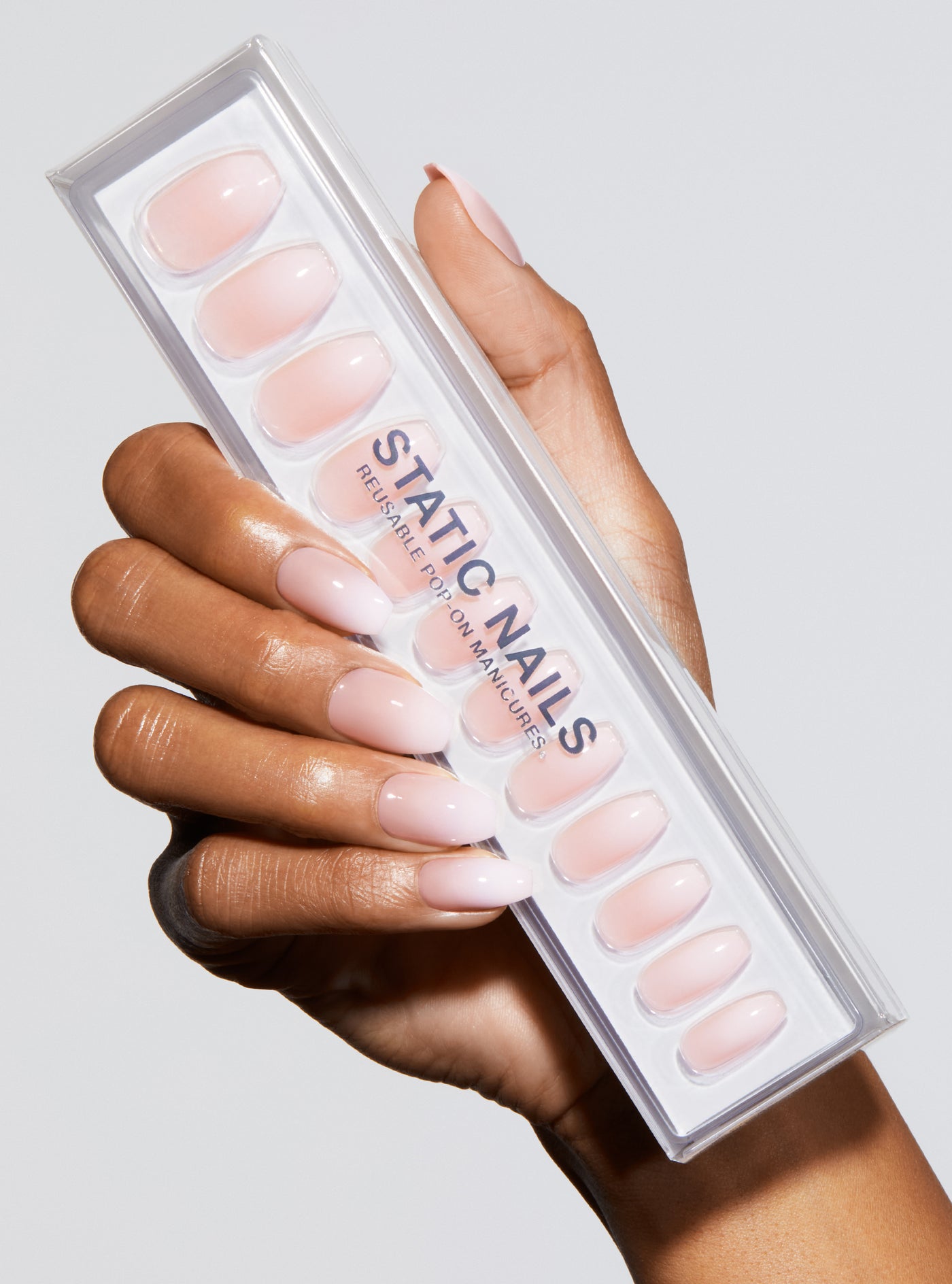 Ombre light pink to white manicure in coffin shape,