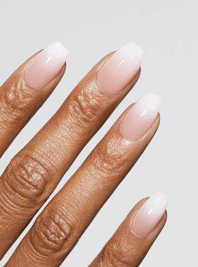 Ombre light pink to white manicure in coffin shape,
