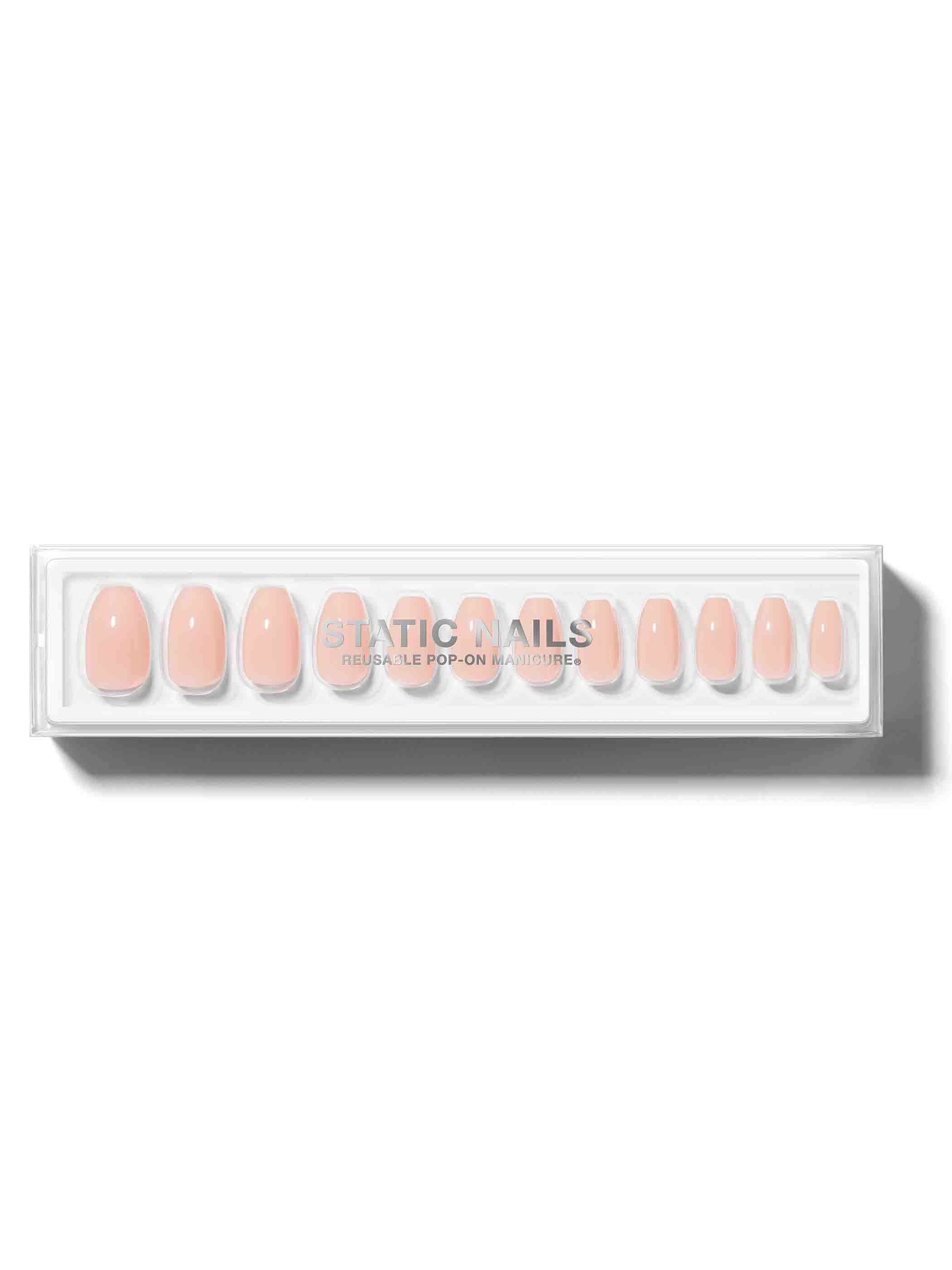 Peach nude manicure in coffin shape,