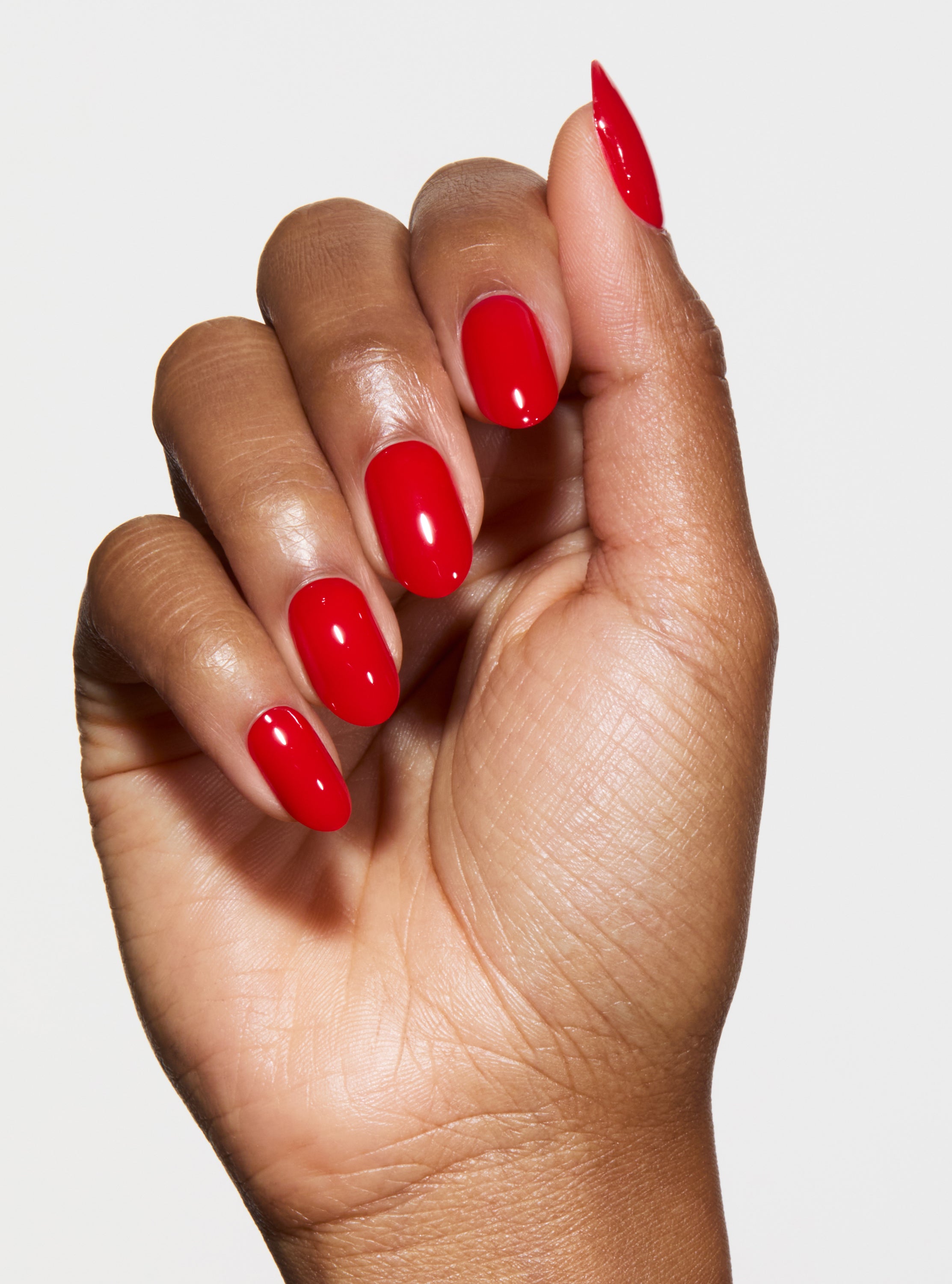 hand with red pop-on nails
