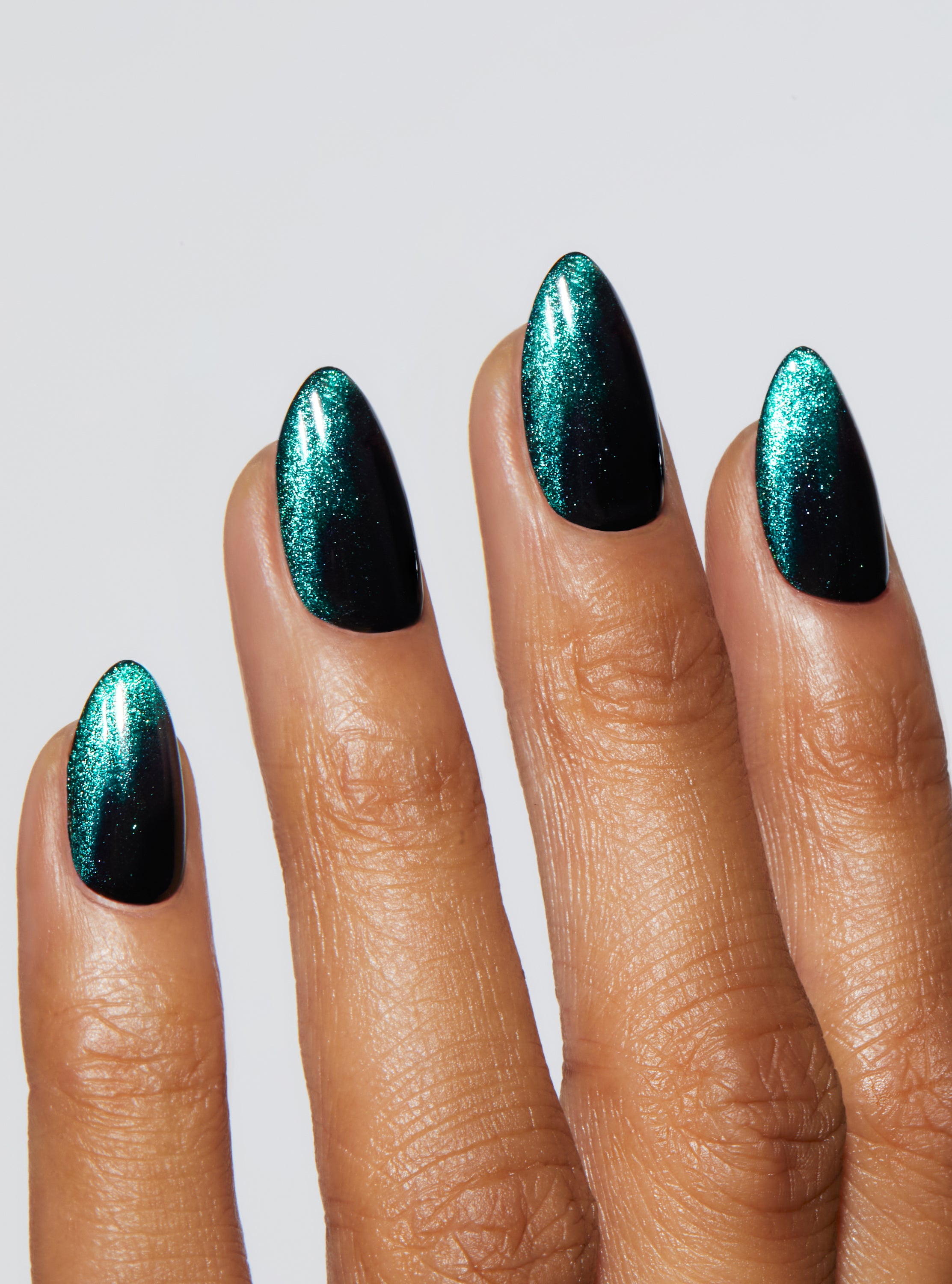 Black nail with green and gold velvet french tip