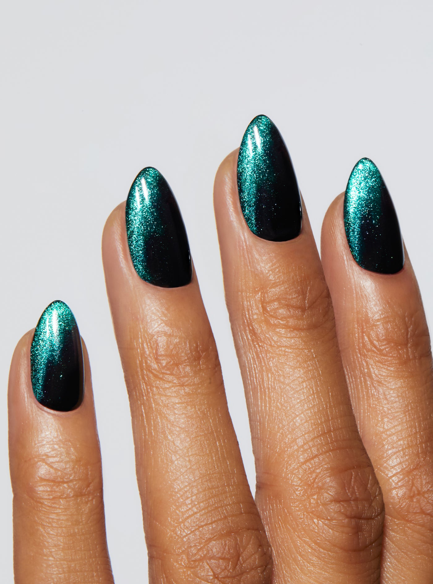 Black nail with green and gold velvet french tip