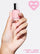 SIGNATURE PINK 5-IN-1 RAPID GROWTH NAIL TREATMENTHand with pink nail polish on a pink background