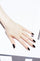 DARK ROOM MANI+PEDI SETBlack lacquer on light skin tone,