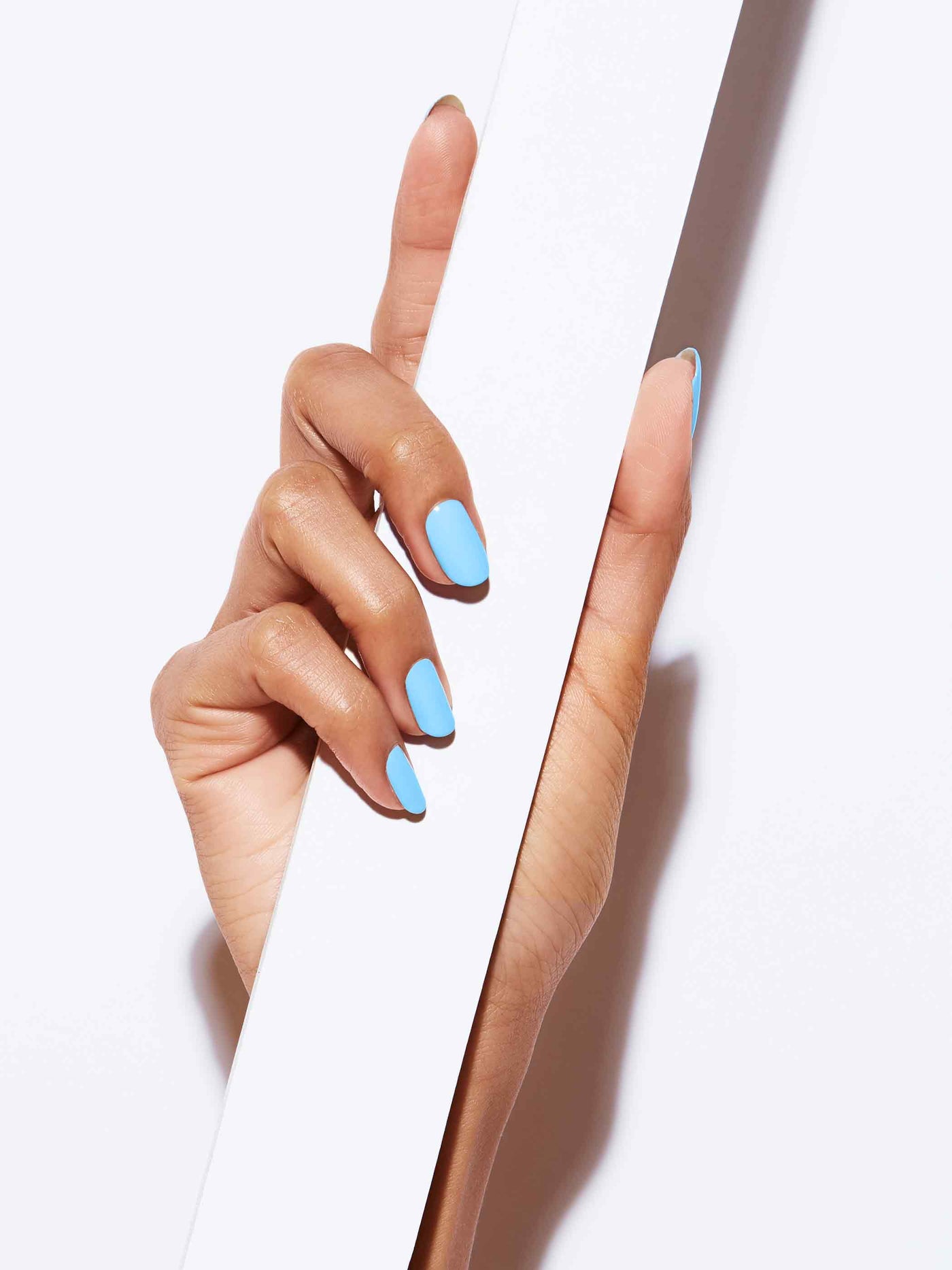 Neon pastel blue full-coverage nail polish, Medium