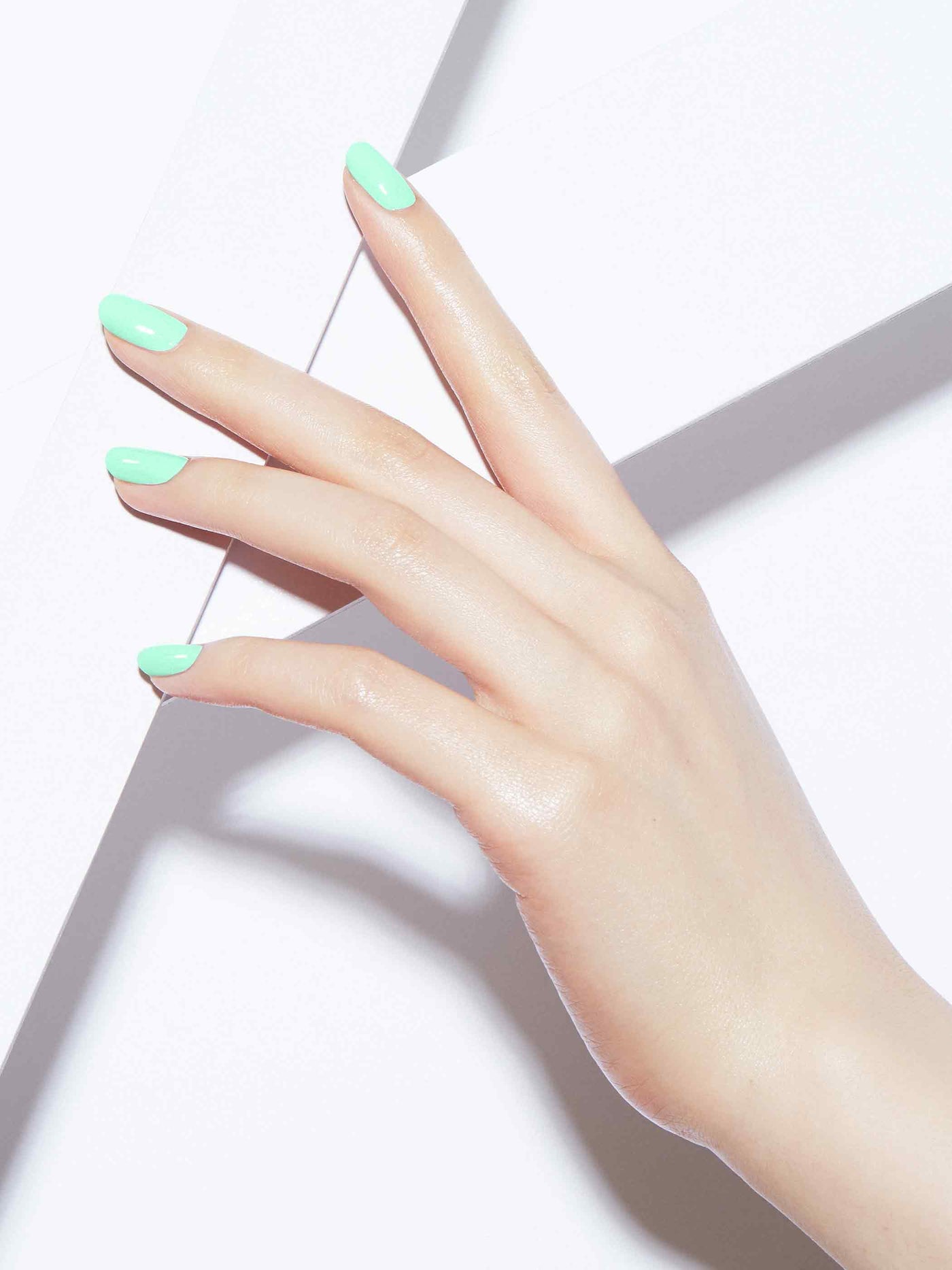 Neon pastel green full-coverage nail polish, Light