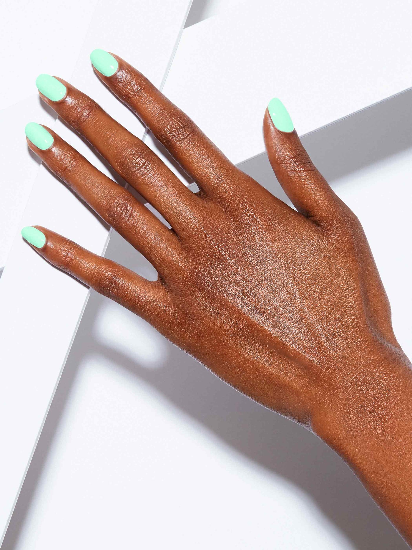 Neon pastel green full-coverage nail polish, Rich