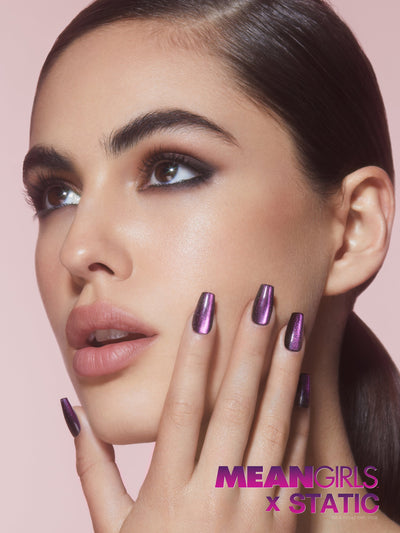 Black velvet effect nails with purple overlay