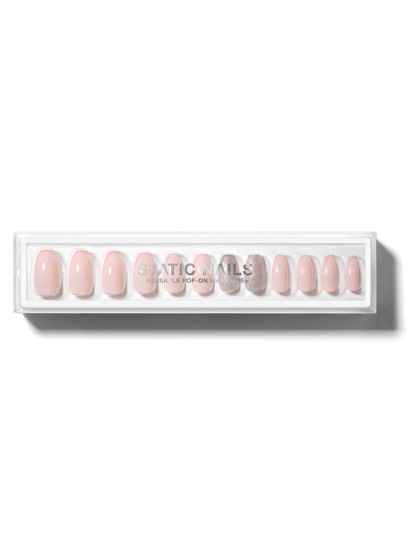 Soft pink manicure with silver glitter accent nail in coffin shape,