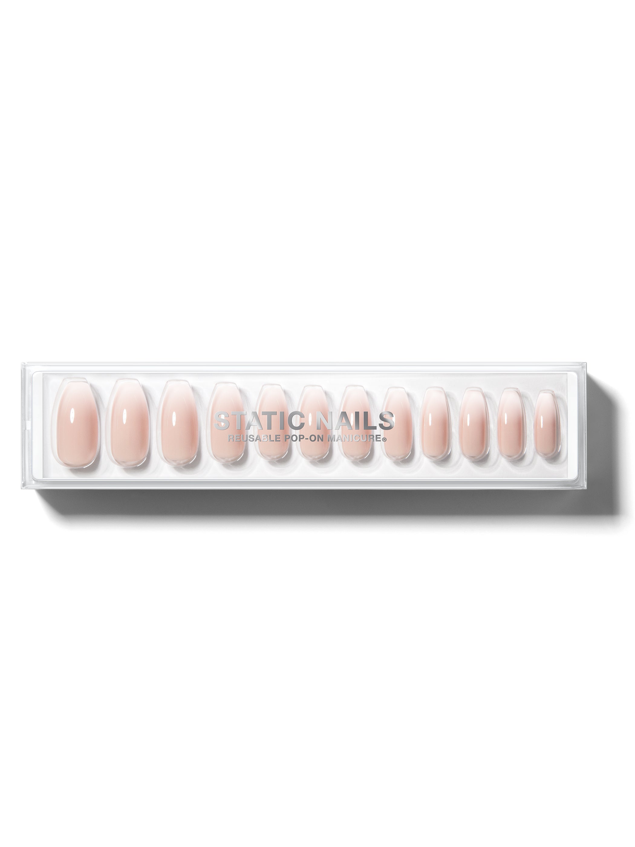 Ombre light pink to white manicure in long coffin shape,