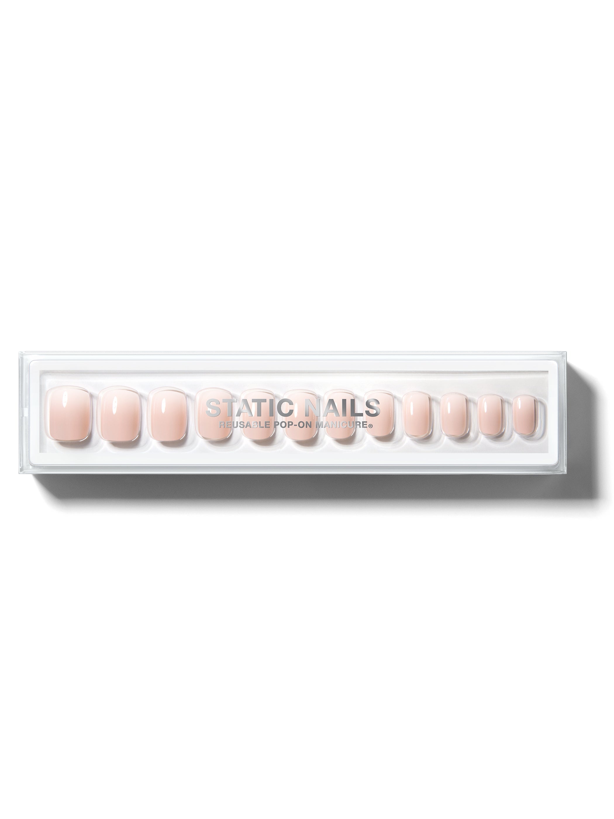 Ombre light pink to white manicure in short square shape,