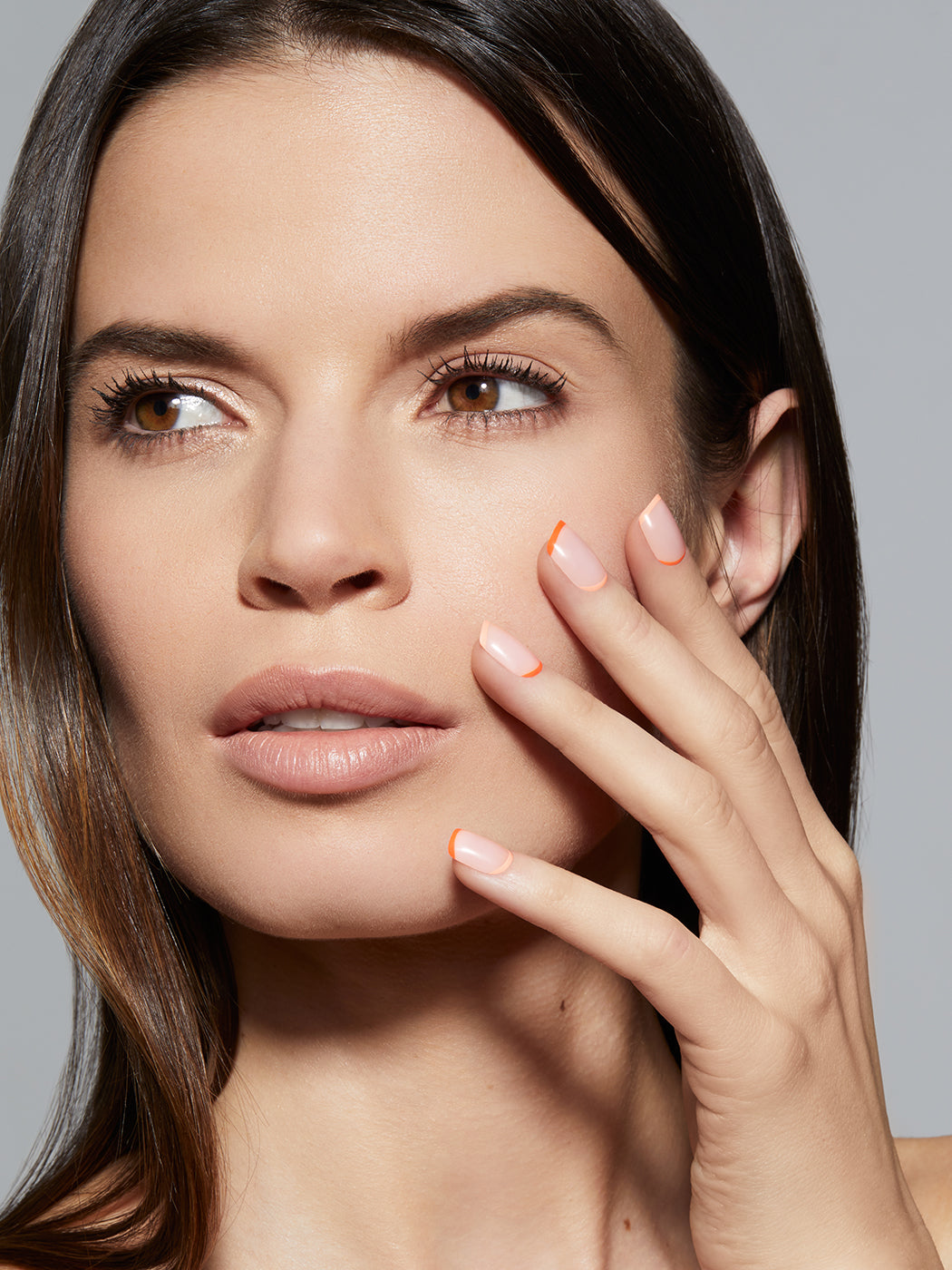 Pink base color with light and dark orange alternating tips,