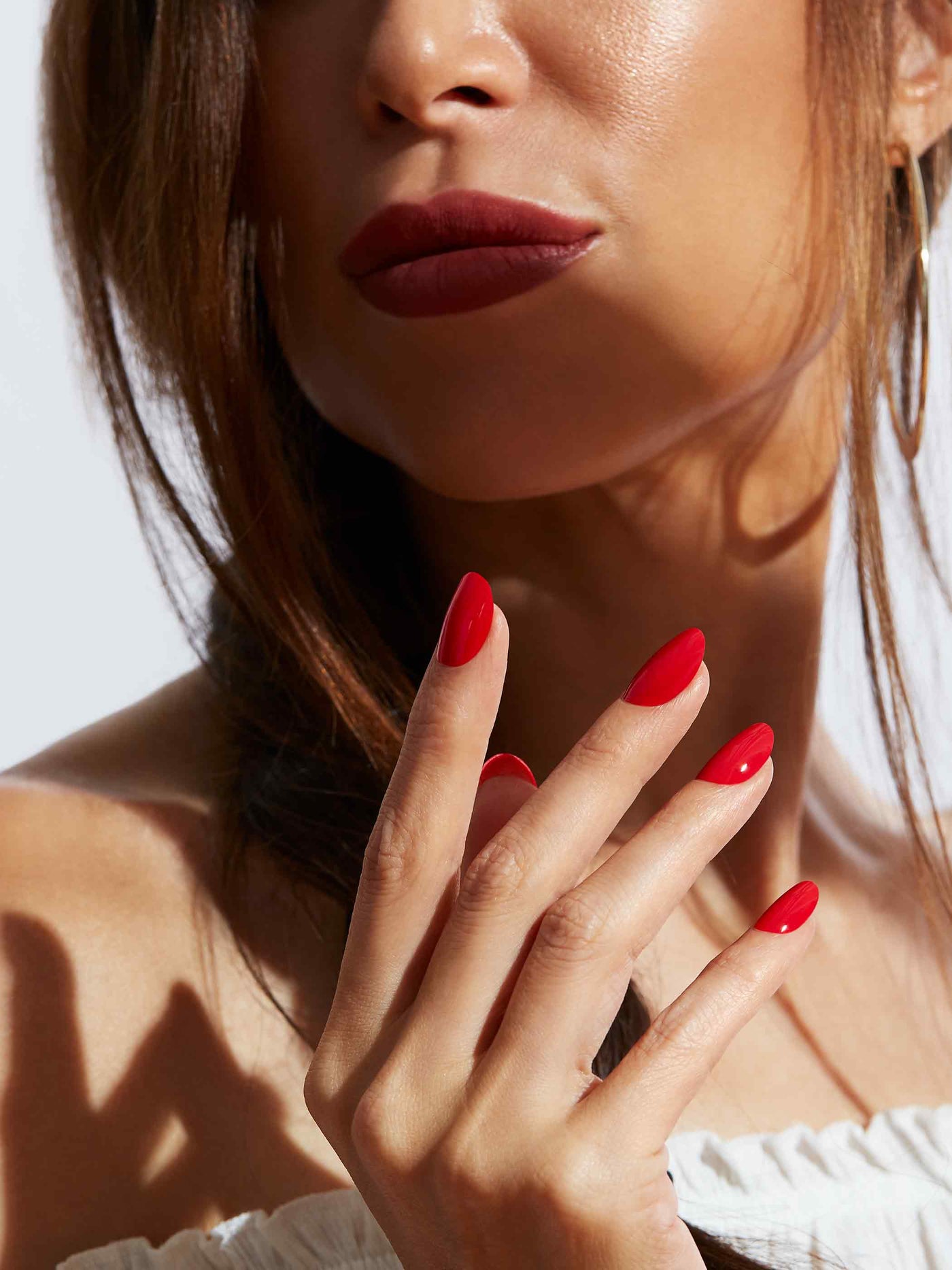 Bold red manicure in round shape,
