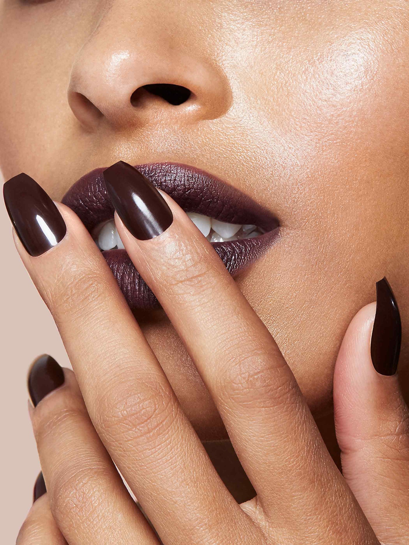 Deepest brown manicure in coffin shape,
