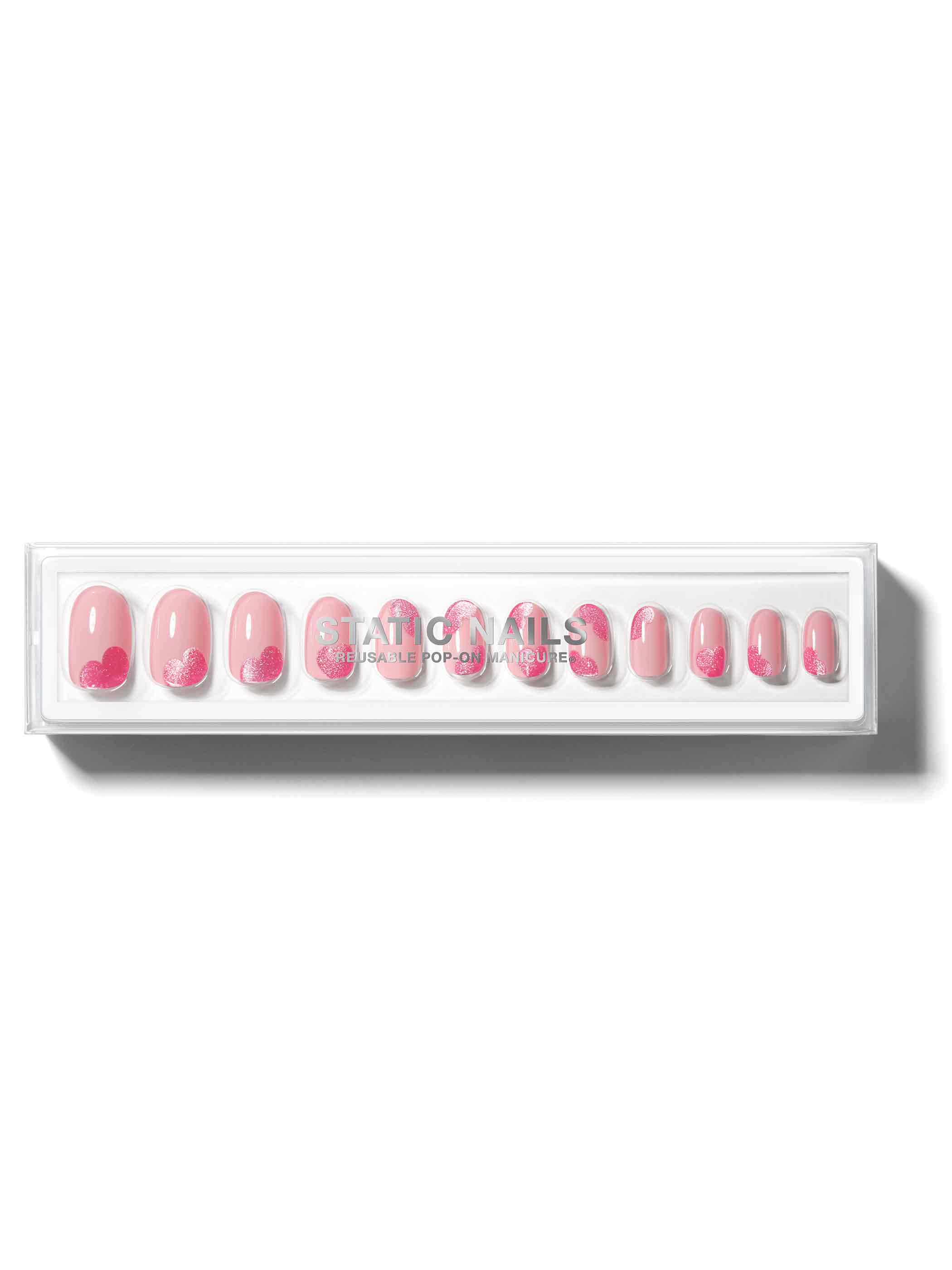 Soft pink base with cat-eye effect pink hearts on all nails in round shape,