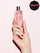 QUITA ESMALTE Y POP-ON 100% NO TÓXICO (AROMA DELICADO A ROSAS)Bottle of pink rose scented nail polish and pop-on nail remover